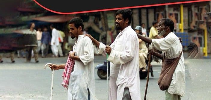 Blind men guiding each other across a chaotic city road