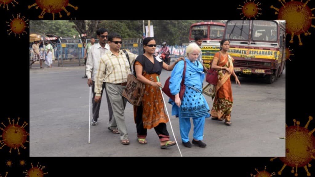 Group of blind people crossing a busy road with help from others
