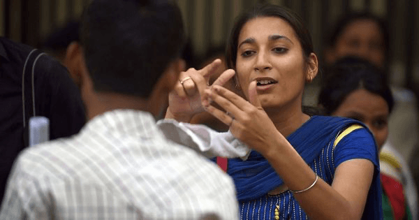 Deaf woman signing intensely during a conversation